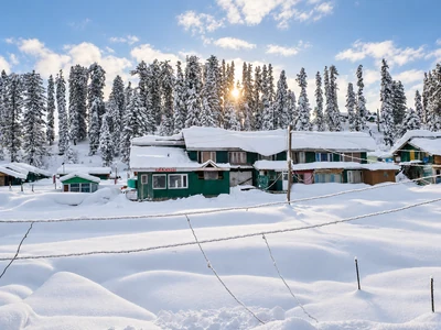 Cottages surrounded by deep winter snow in Gulmarg