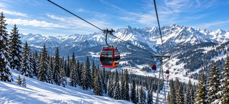 Gondola cabins above snow-covered Gulmarg slopes